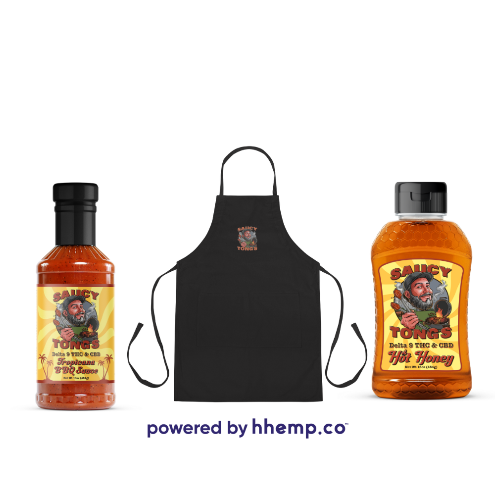 Saucy Tongs Bundle With Infused Tropicana BBQ Sauce bottle, Black Apron with Saucy Tongs Logo printed on the front, and Saucy Tongs Infused Hot Honey